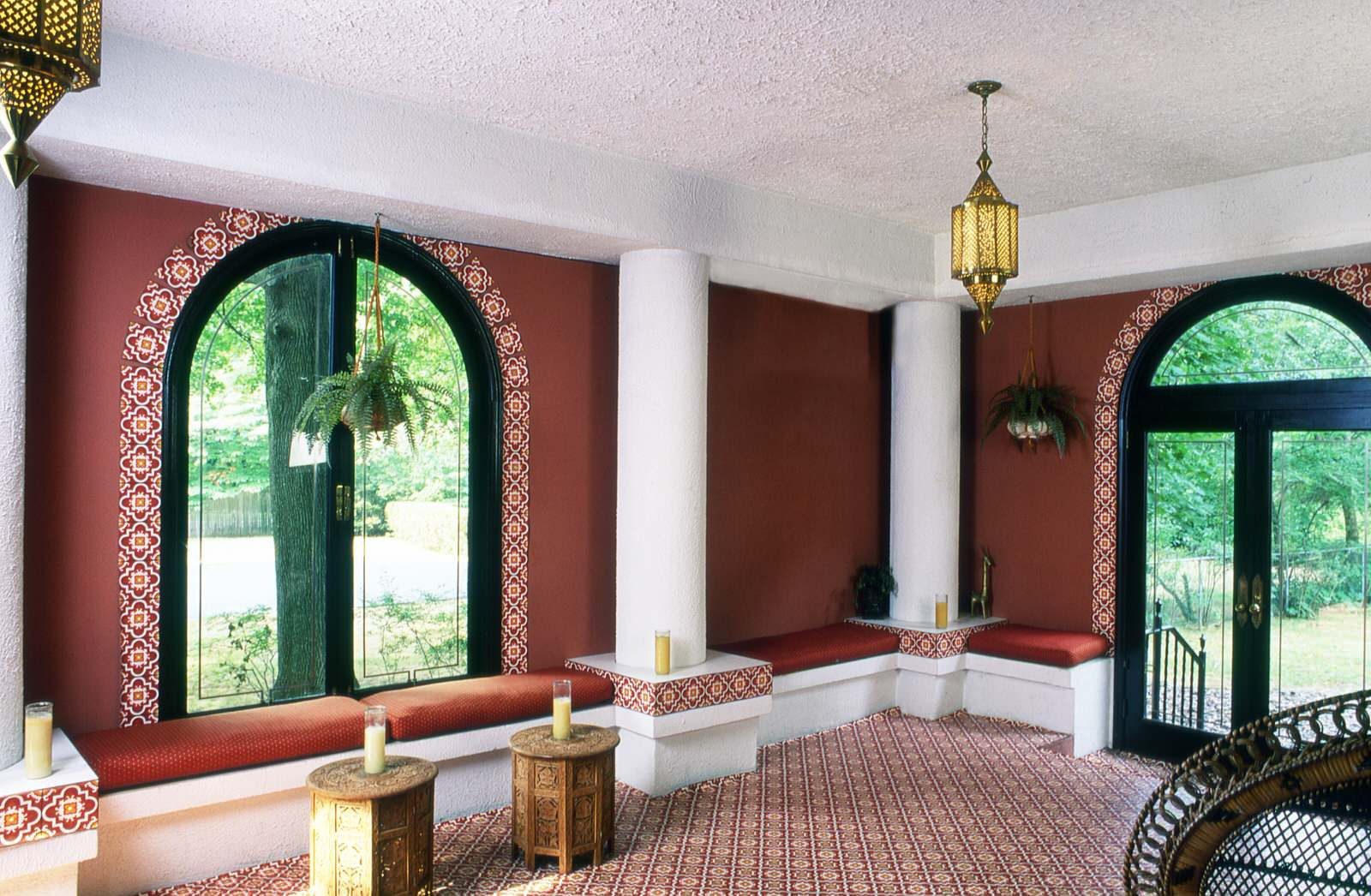 Elegant room with arched windows and decor